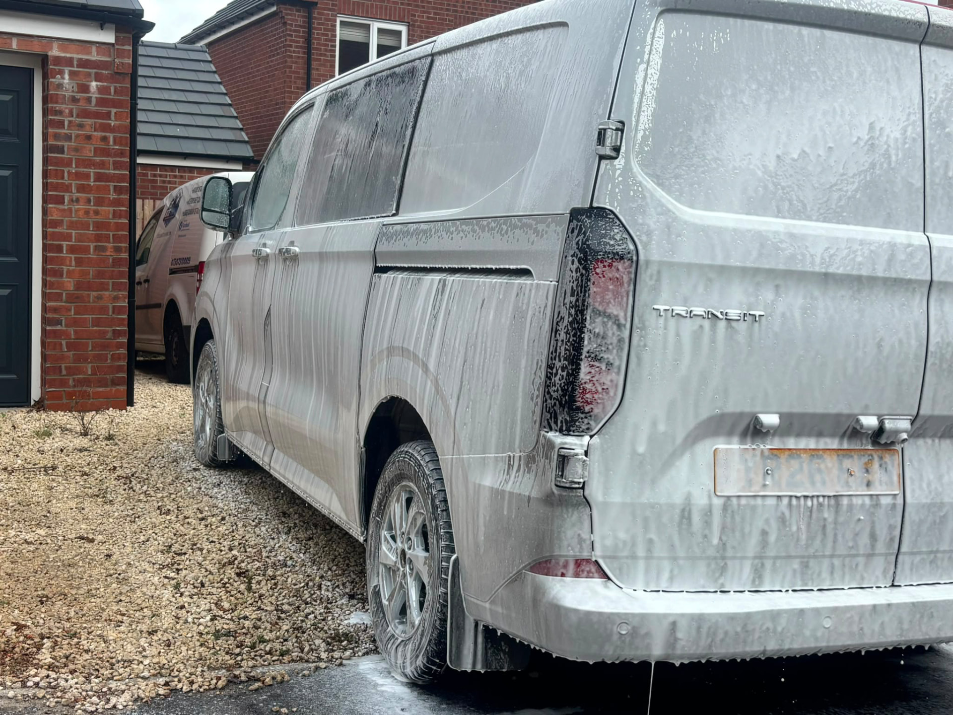 Van covered in snow foam during a valeting wash