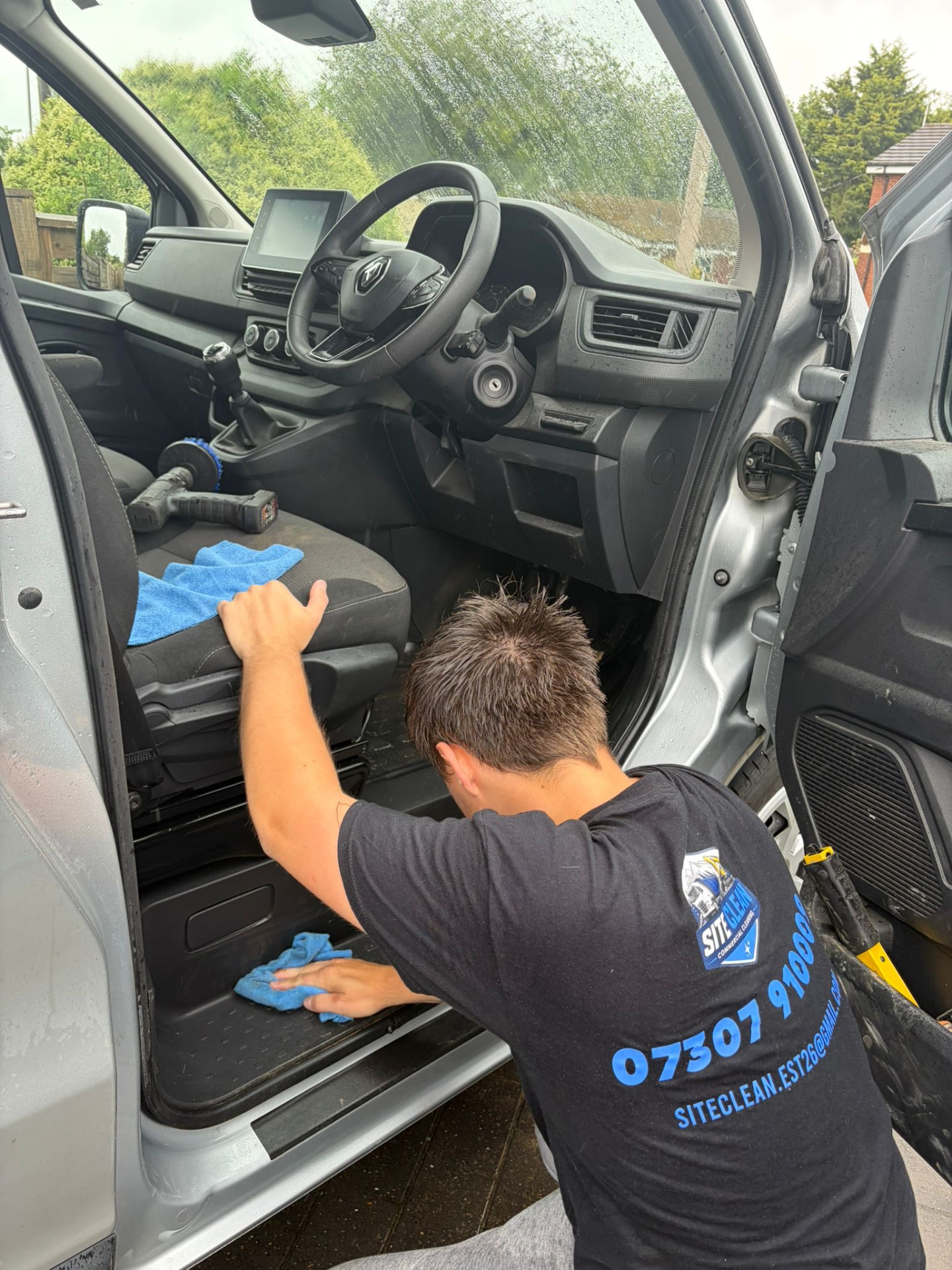 Site Clean technician deep cleaning a van interior